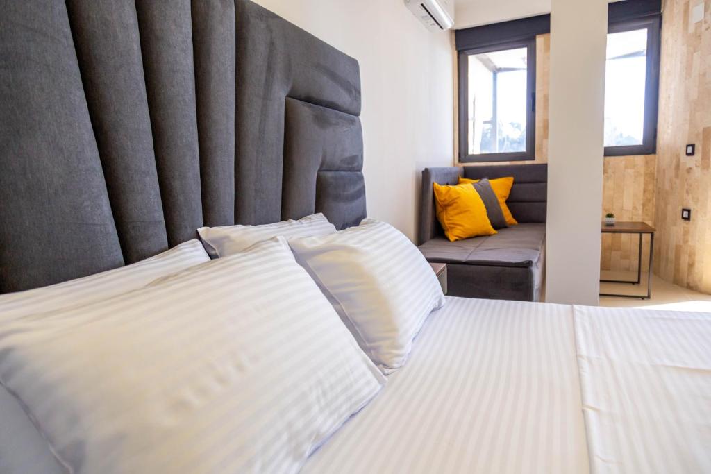 Postel nebo postele na pokoji v ubytování Sand Apartments