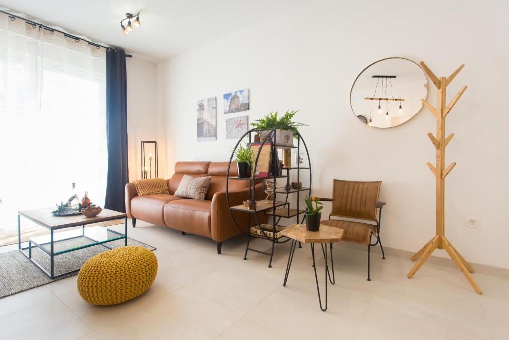 a living room with a couch and a table at Domus Korcula in Korčula