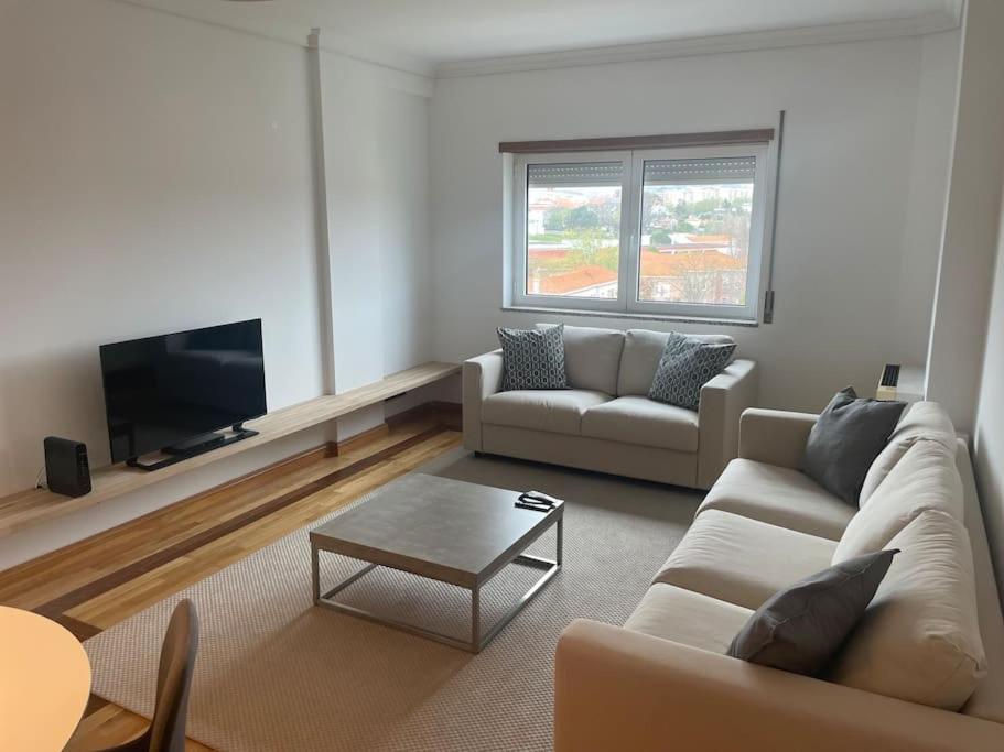 a living room with a couch and a coffee table at ASF Brasil in Lisbon