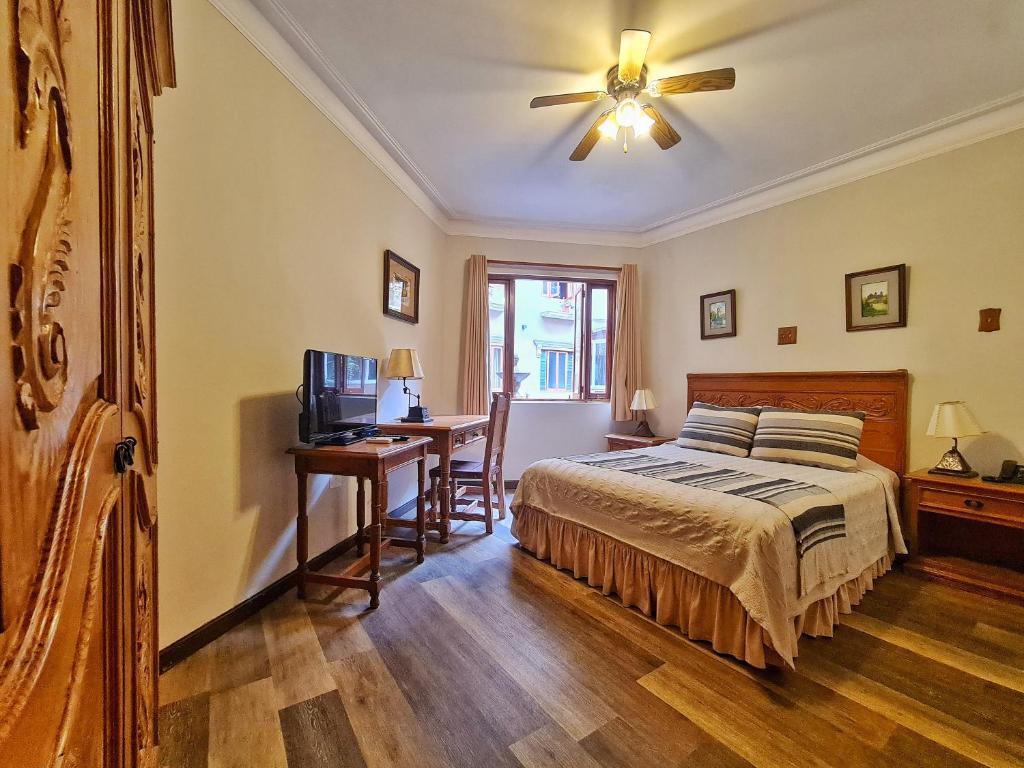 Postel nebo postele na pokoji v ubytování Hotel Antigua Miraflores