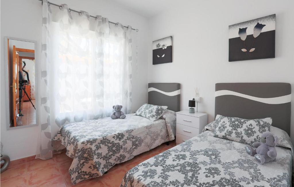 A bed or beds in a room at Bluemoon 2