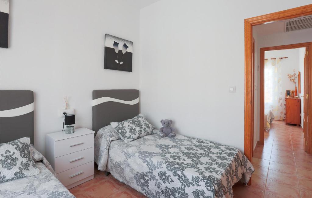 A bed or beds in a room at Bluemoon 2