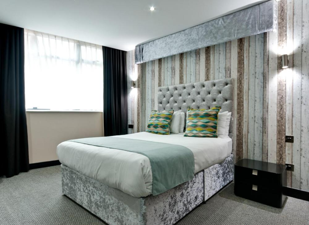Postel nebo postele na pokoji v ubytování Print Works Hotel