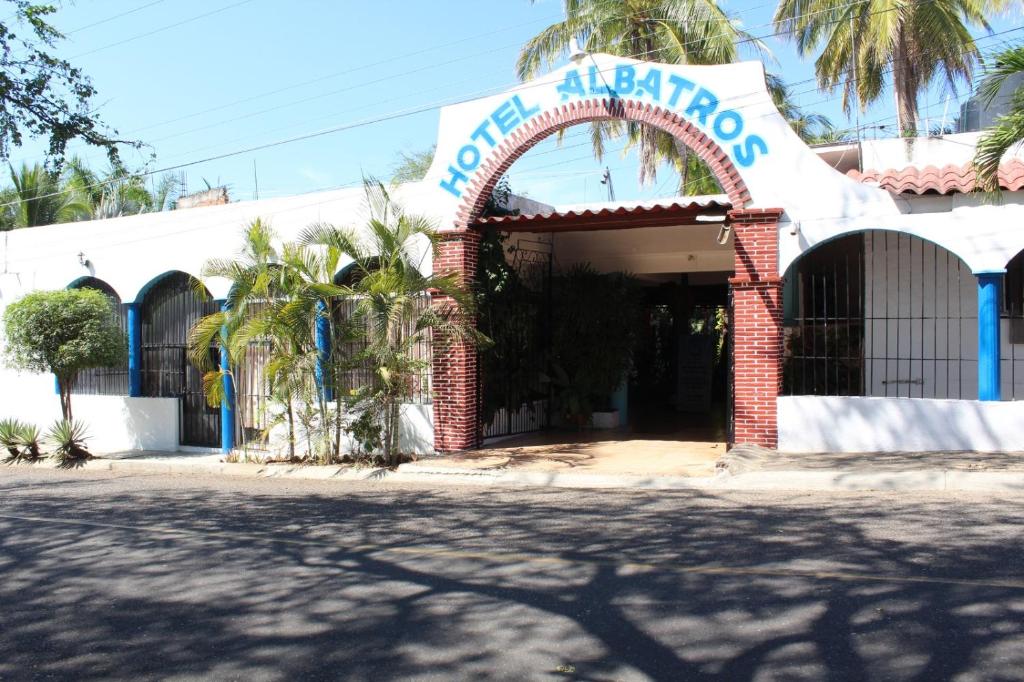 a building with a sign that reads hotel hacienda at Hotel Albatros in Puerto Escondido