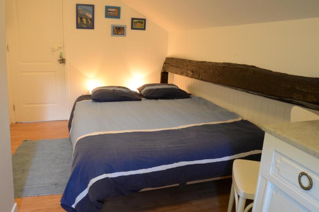 Postel nebo postele na pokoji v ubytování Gîte la Passerelle à Mouzaive