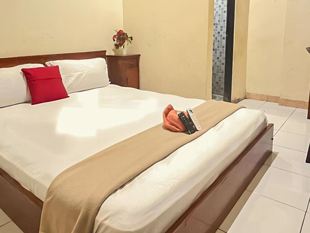 Katil atau katil-katil dalam bilik di Akavi Homestay Jayapura Redpartner