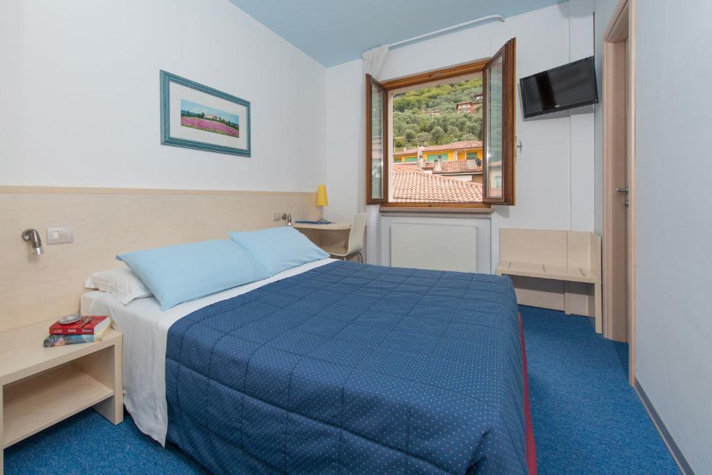 Postel nebo postele na pokoji v ubytování Hotel Erika