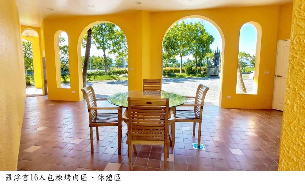 a dining room with a table and chairs at Jane Castle in Wujie