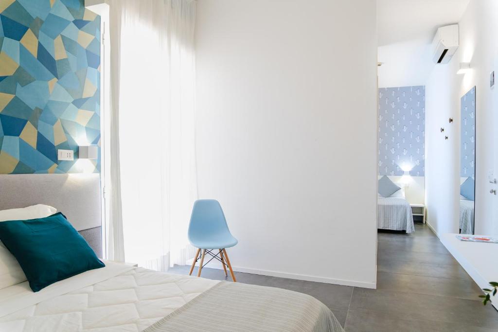 Postel nebo postele na pokoji v ubytování Hotel Mon Pays