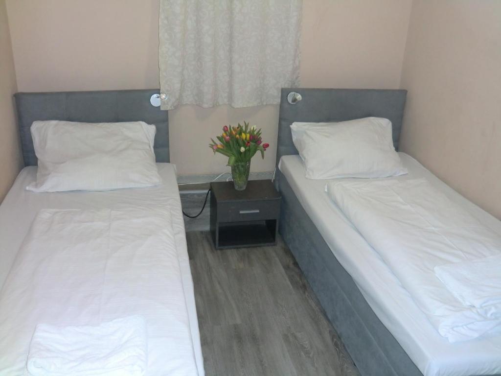 Postel nebo postele na pokoji v ubytování Panorama Hotel Frankfurt Offenbach Süd