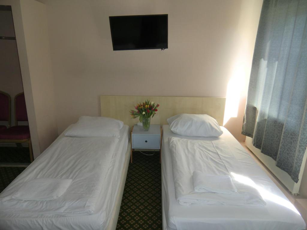 Postel nebo postele na pokoji v ubytování Panorama Hotel Frankfurt Offenbach Süd