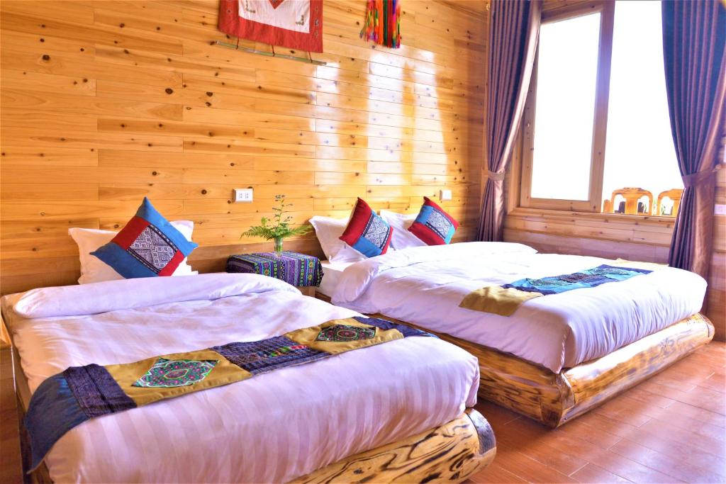 Postel nebo postele na pokoji v ubytování Hmong Eco Villas