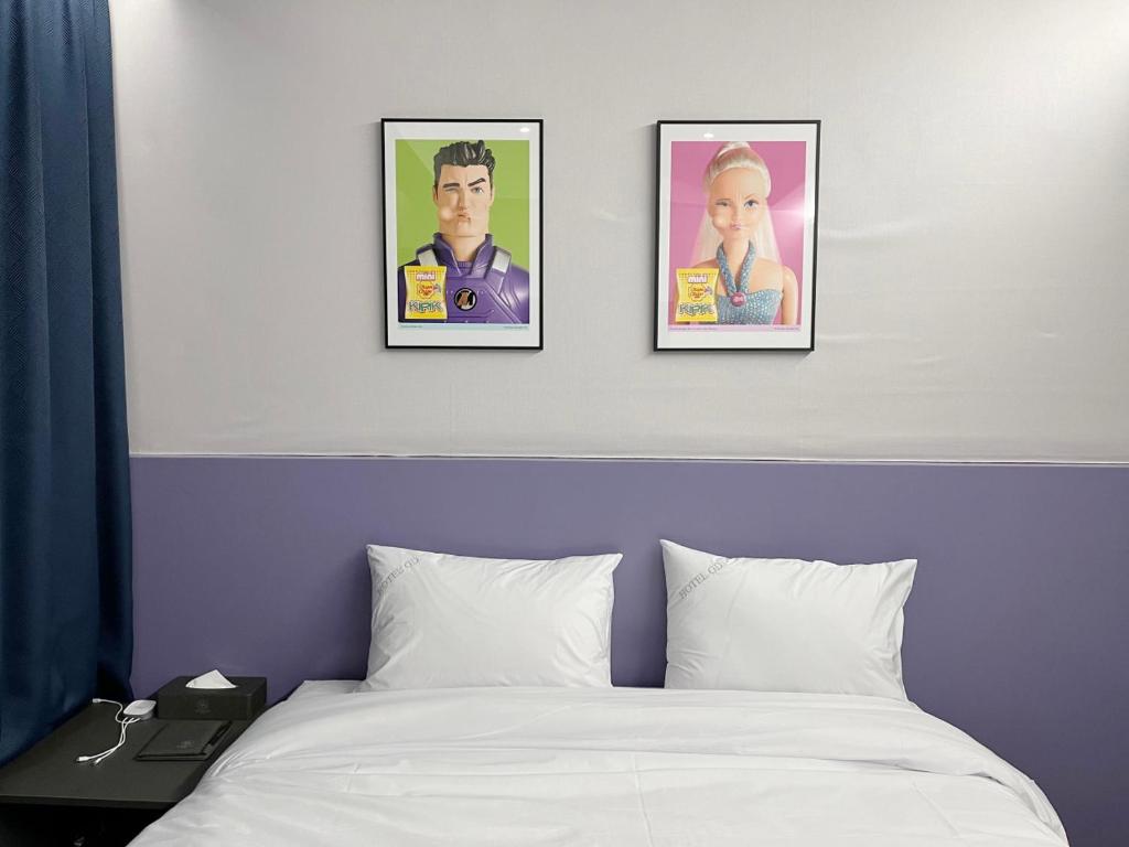 Postel nebo postele na pokoji v ubytování GD Hotel