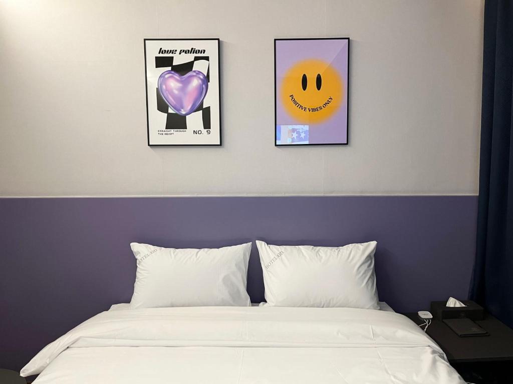 Postel nebo postele na pokoji v ubytování GD Hotel