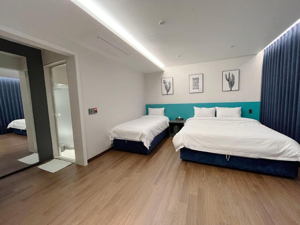 Postel nebo postele na pokoji v ubytování GD Hotel