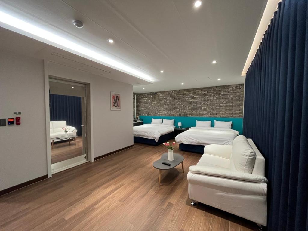 Postel nebo postele na pokoji v ubytování GD Hotel