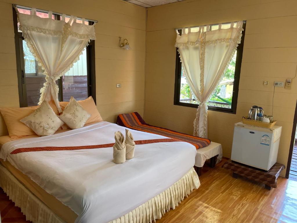 Postel nebo postele na pokoji v ubytování Starlight Haadrin Resort
