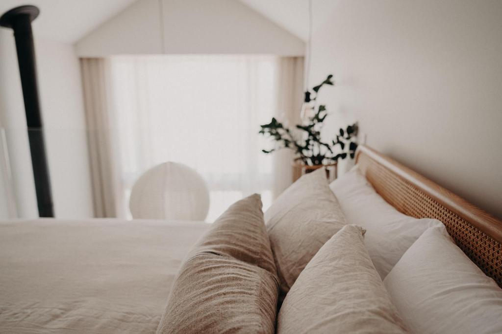 a close up of a bed with pillows on it at View Street Studios - Tallerack in Albany