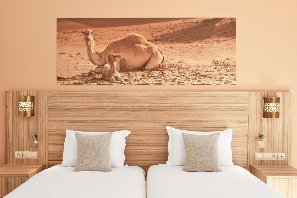 Postel nebo postele na pokoji v ubytování Iberostar Waves Club Palmeraie Marrakech All Inclusive