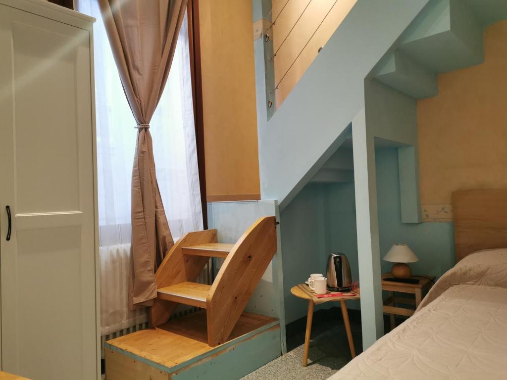 Łóżko lub łóżka w pokoju w obiekcie Venice Dose Suite