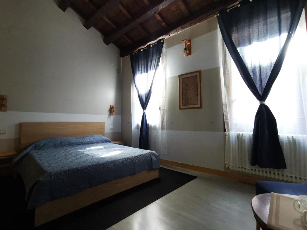 Łóżko lub łóżka w pokoju w obiekcie Venice Dose Suite