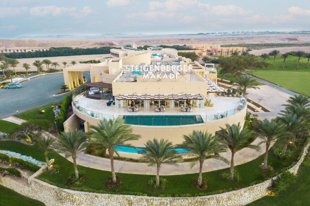 an aerial view of a resort with a pool and palm trees at Steigenberger Makadi - Adults Friendly 16 Years Plus in Hurghada