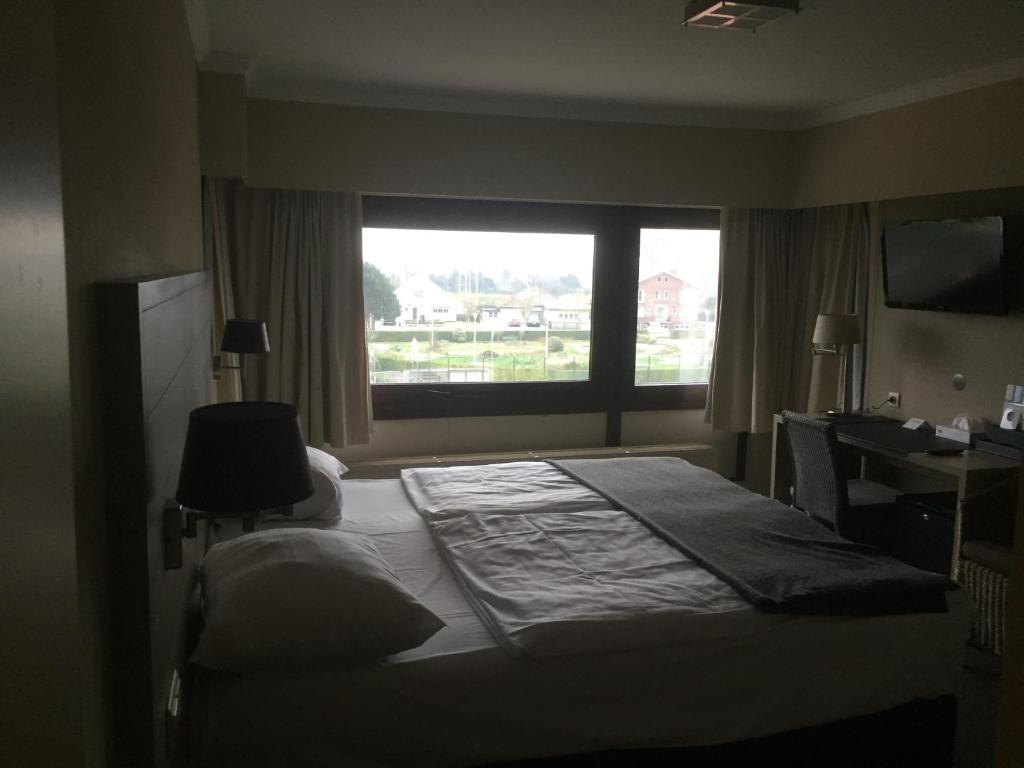 Postel nebo postele na pokoji v ubytování Hotel Atlas
