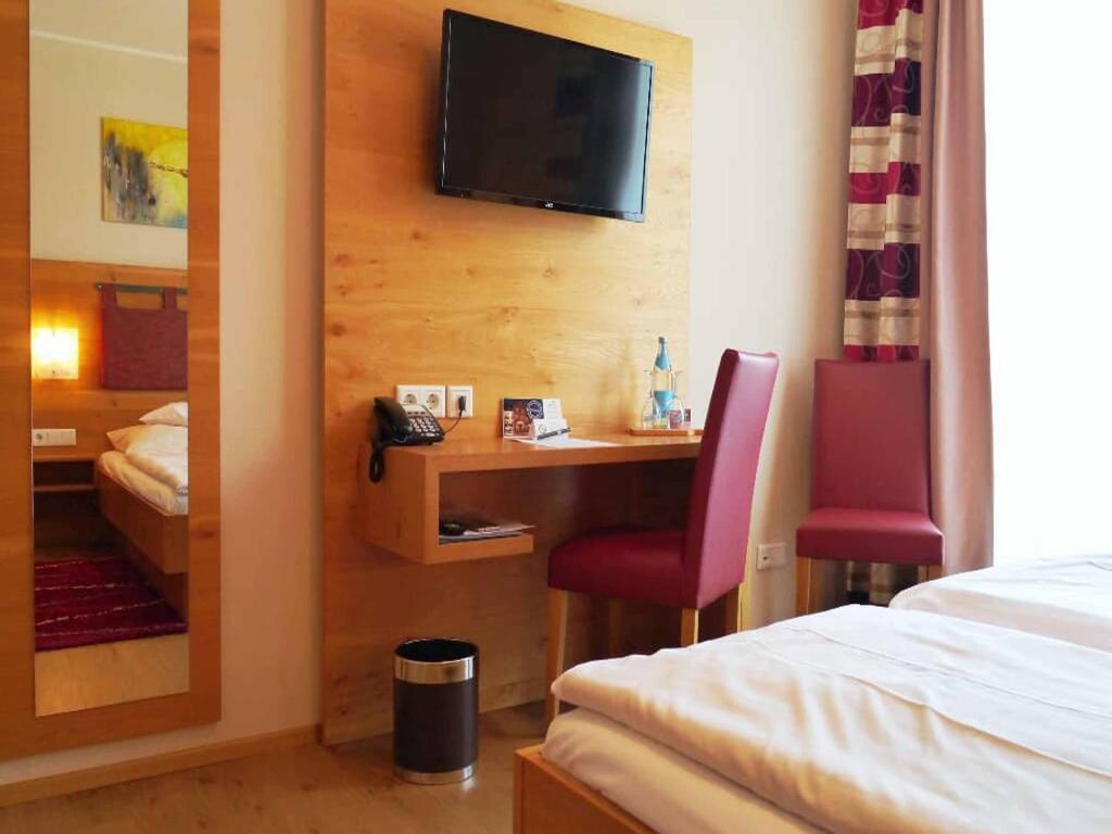 Postel nebo postele na pokoji v ubytování Da`Sporrer Hotel & Wirtshaus