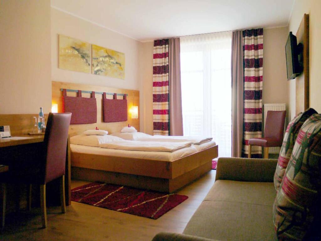 Postel nebo postele na pokoji v ubytování Da`Sporrer Hotel & Wirtshaus