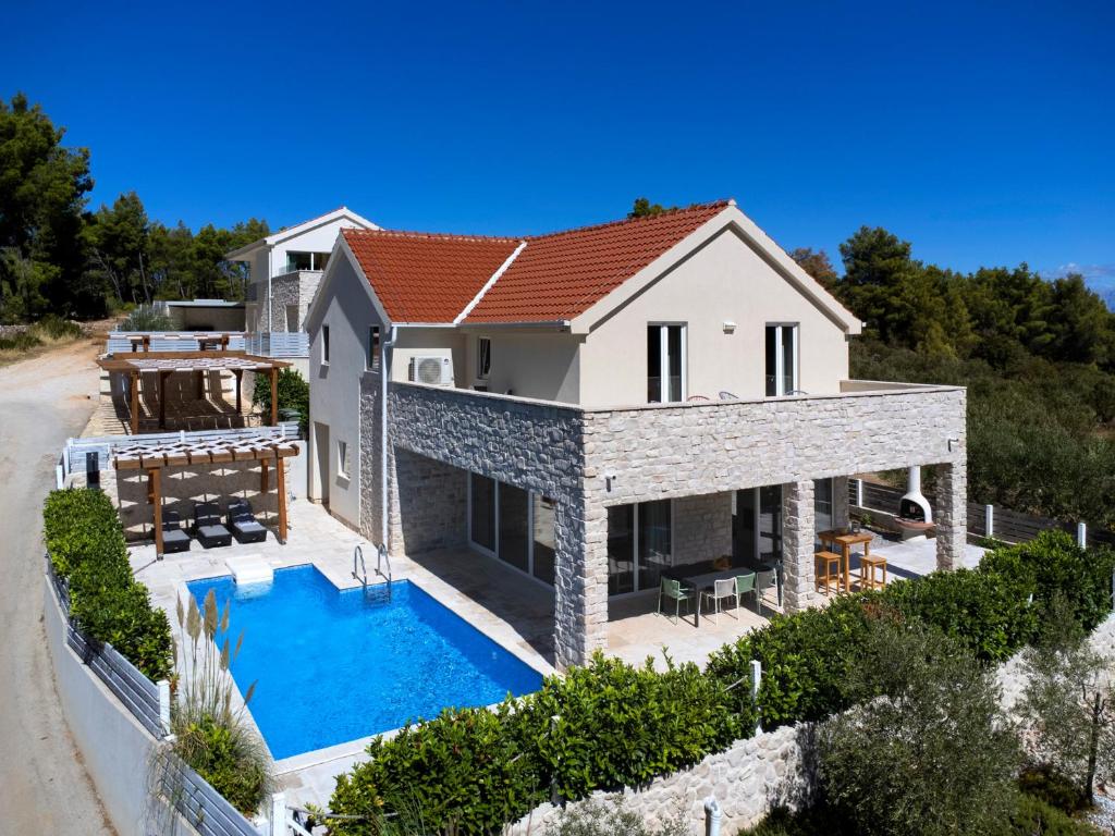 an aerial view of a villa with a swimming pool at Villa Anouk in Pitve