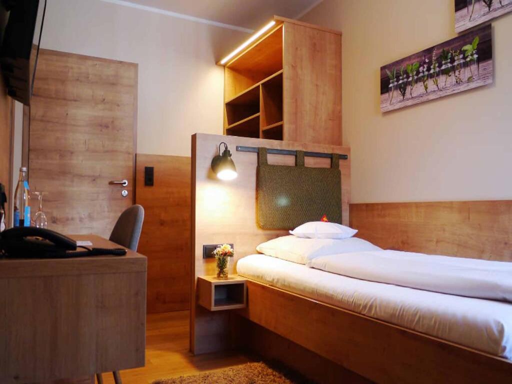 Postel nebo postele na pokoji v ubytování Da`Sporrer Hotel & Wirtshaus