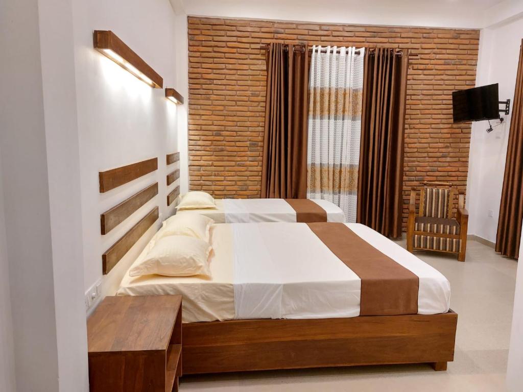 Postel nebo postele na pokoji v ubytování Green Shield Resort