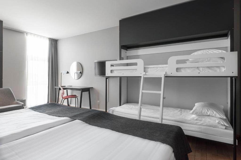 Postel nebo postele na pokoji v ubytování Quality Hotel 11 & Eriksbergshallen