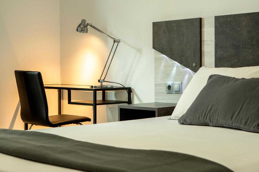 Postel nebo postele na pokoji v ubytování Apartamentos Aponiente