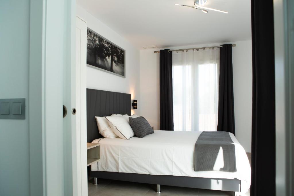 Postel nebo postele na pokoji v ubytování Apartamentos Aponiente