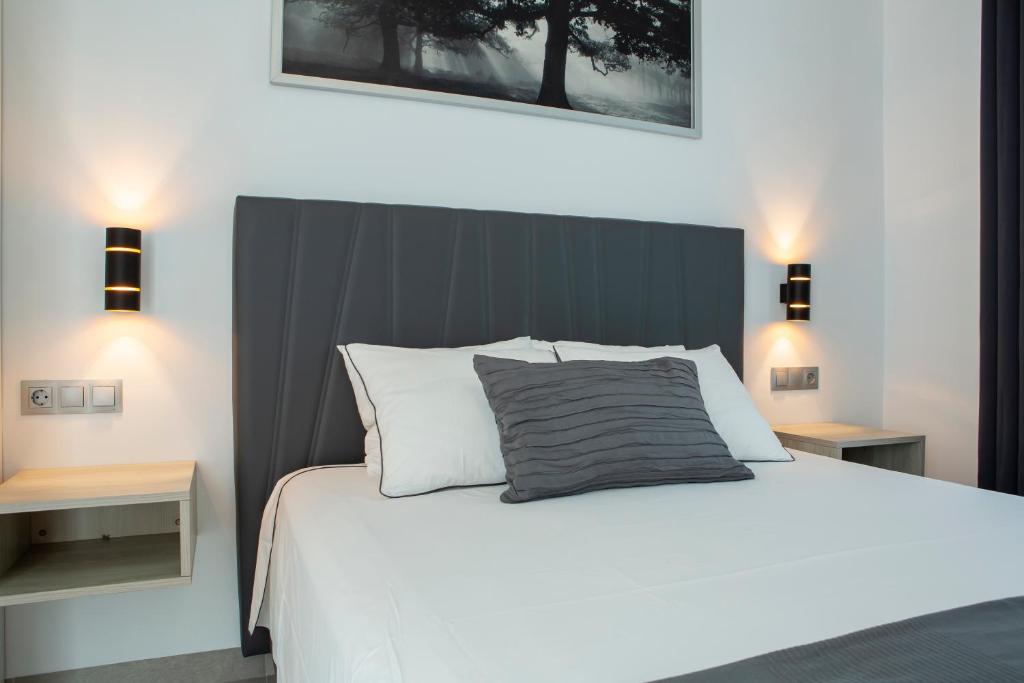 Postel nebo postele na pokoji v ubytování Apartamentos Aponiente