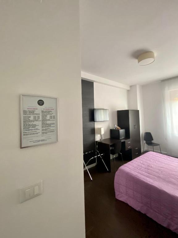 Postel nebo postele na pokoji v ubytování Domus Corso Umberto 18 B&B