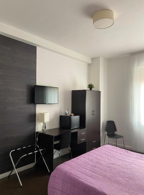 TV a/nebo společenská místnost v ubytování Domus Corso Umberto 18 B&B