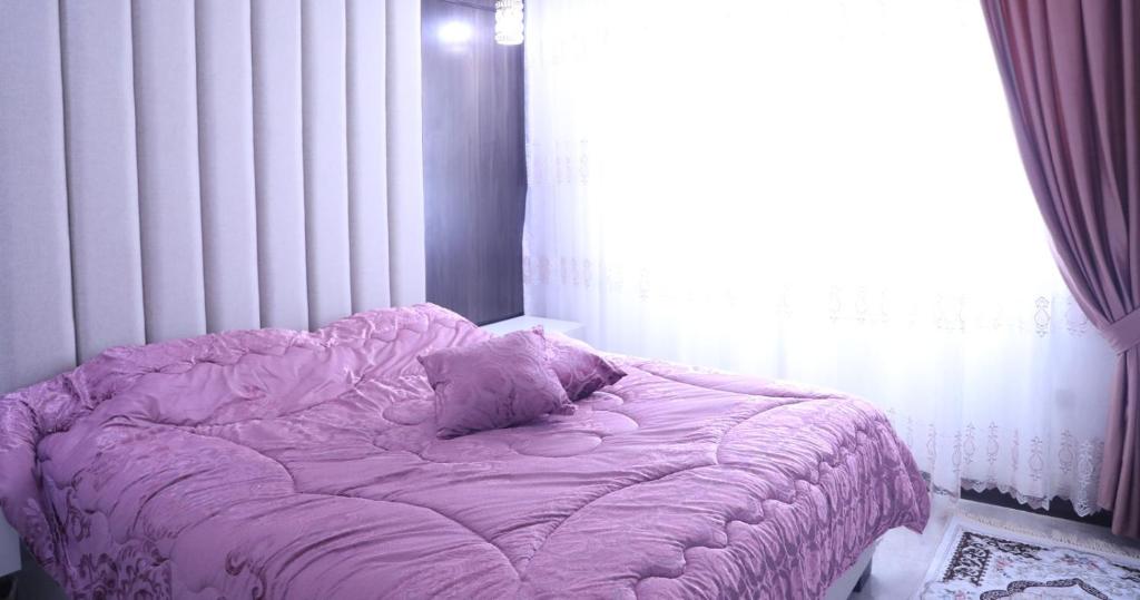 Postel nebo postele na pokoji v ubytování اوليفيا للشقق الفندقية