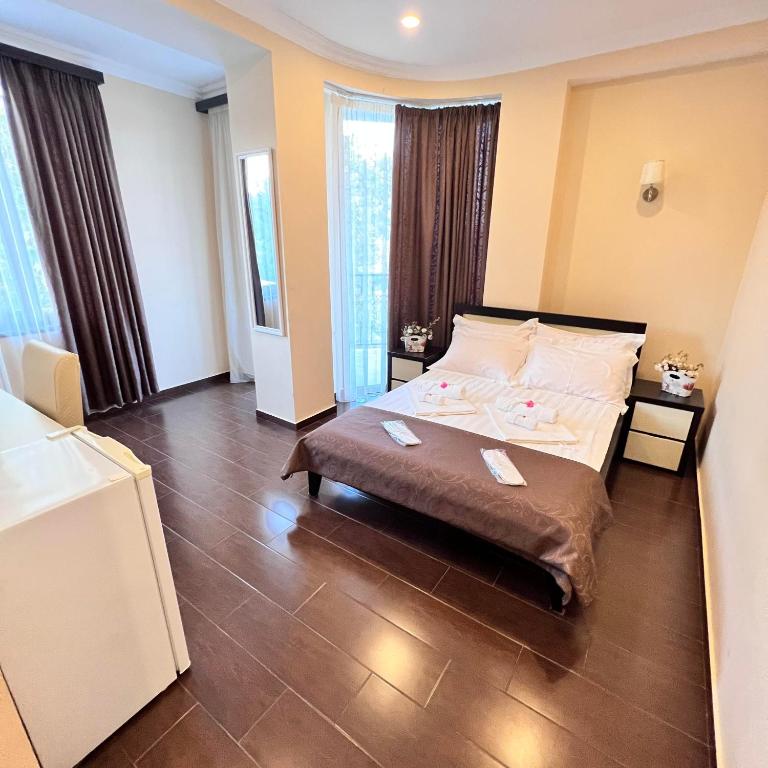 Postel nebo postele na pokoji v ubytování GNS Hotel
