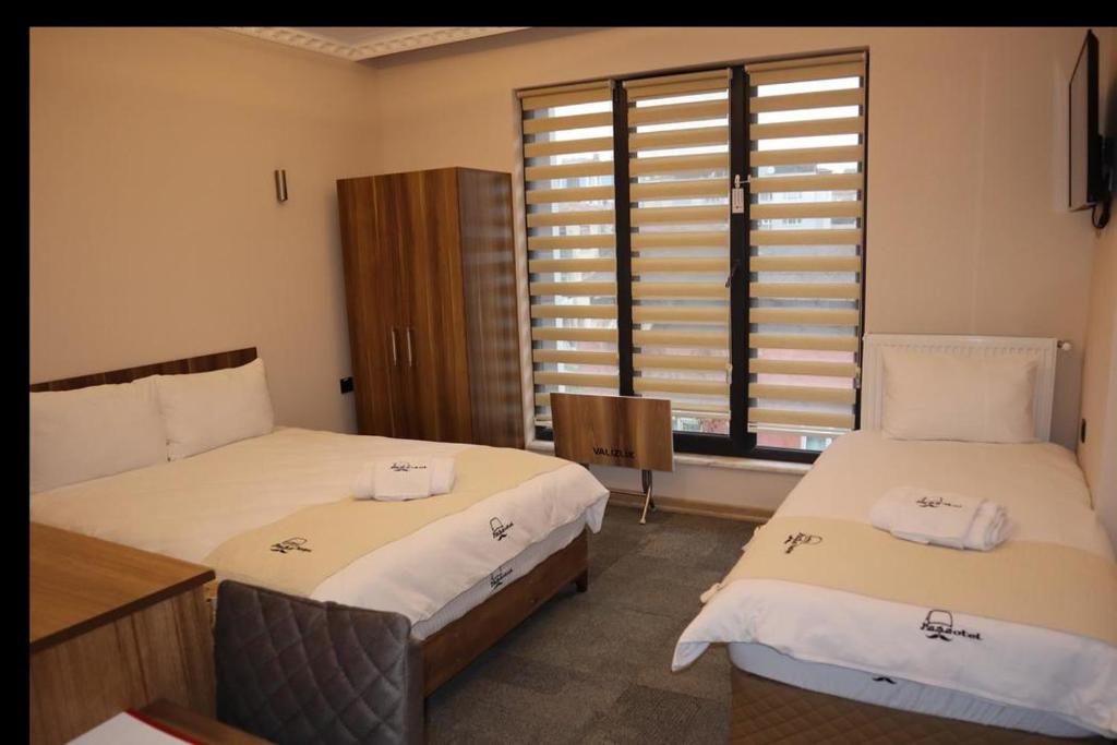 Postel nebo postele na pokoji v ubytování Osmanlı Paşa Otel- Konaklama