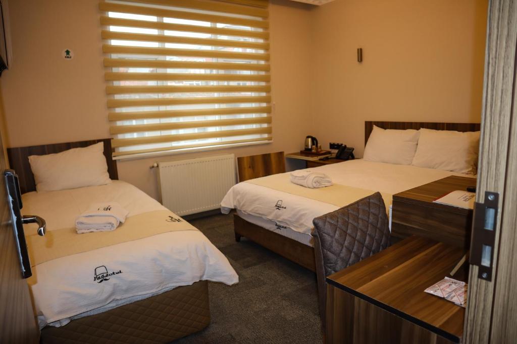 Postel nebo postele na pokoji v ubytování Osmanlı Paşa Otel- Konaklama