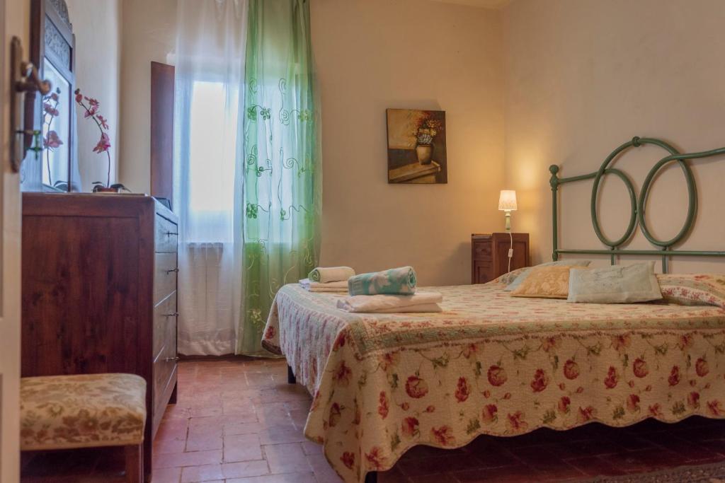 Postel nebo postele na pokoji v ubytování Agriturismo La Ripolina