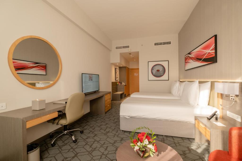 Postel nebo postele na pokoji v ubytování Peony Hotel