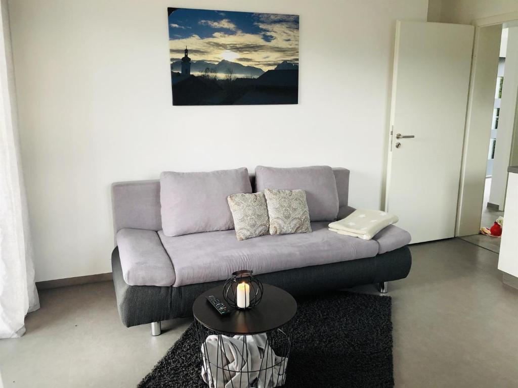 a living room with a couch and a table at Ferienwohnung Vivien in Rieden