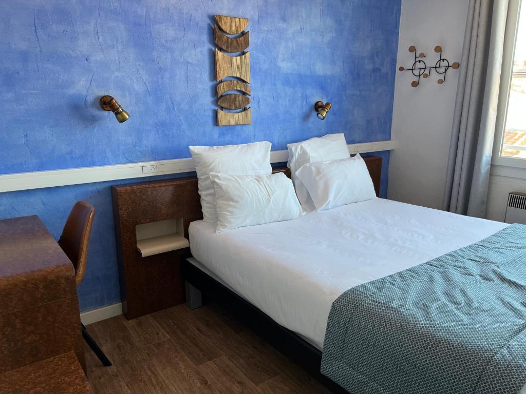 Postel nebo postele na pokoji v ubytování Hôtel Le Mirage
