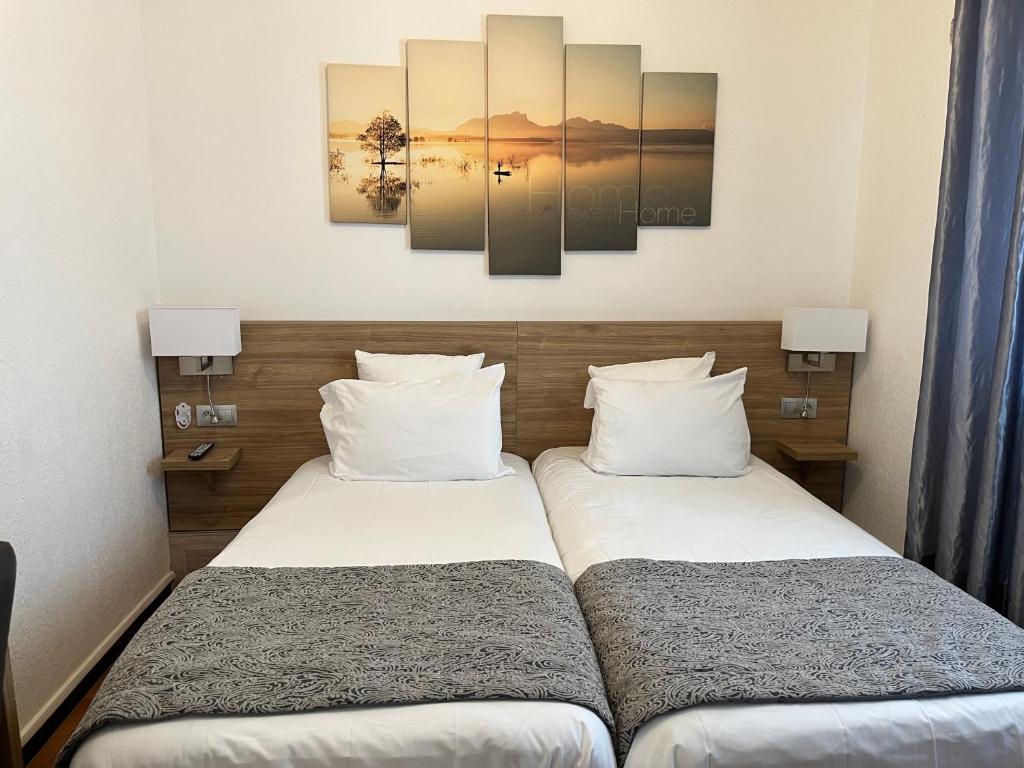 Postel nebo postele na pokoji v ubytování Hôtel Le Mirage