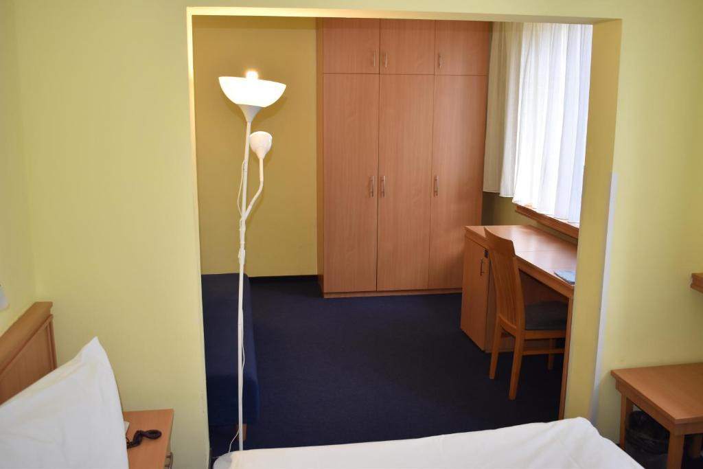 Postel nebo postele na pokoji v ubytování Hotel Tomislavov Dom