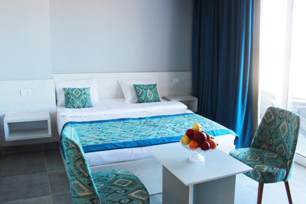 Кровать или кровати в номере Shellghada Blue Beach