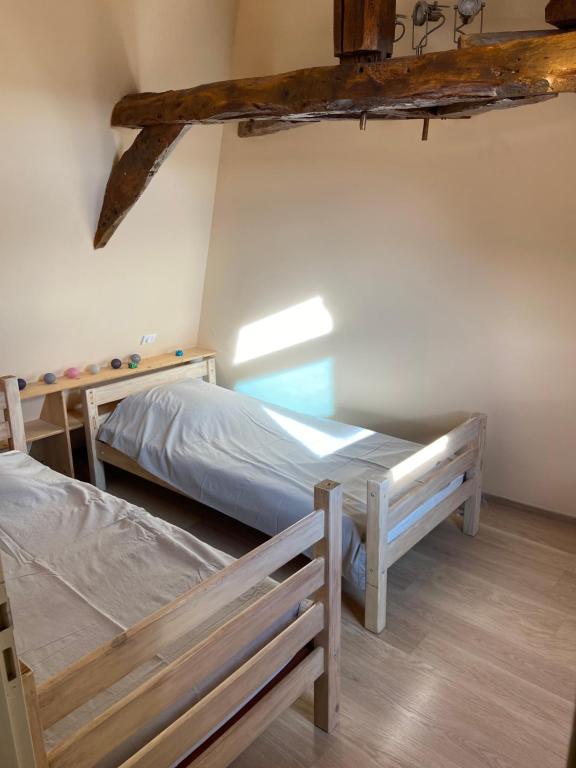 Posteľ alebo postele v izbe v ubytovaní Notre petite maison dans la prairie